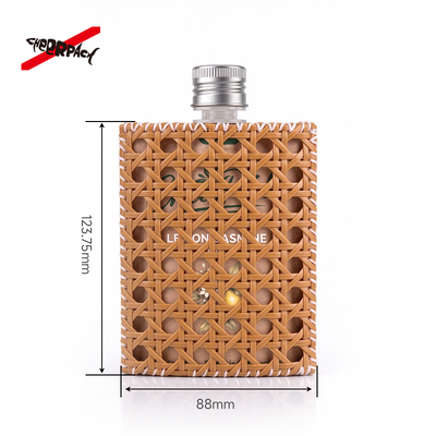 Reusable Rattan Woven Spout Pouch with Aluminum Cap | CheerPack Patented 100ml rattan-woven hollow-out spout pouch with reusable Sleeve and aluminum screw cap. Eco cosmetic packaging, OEM/ODM welcome.